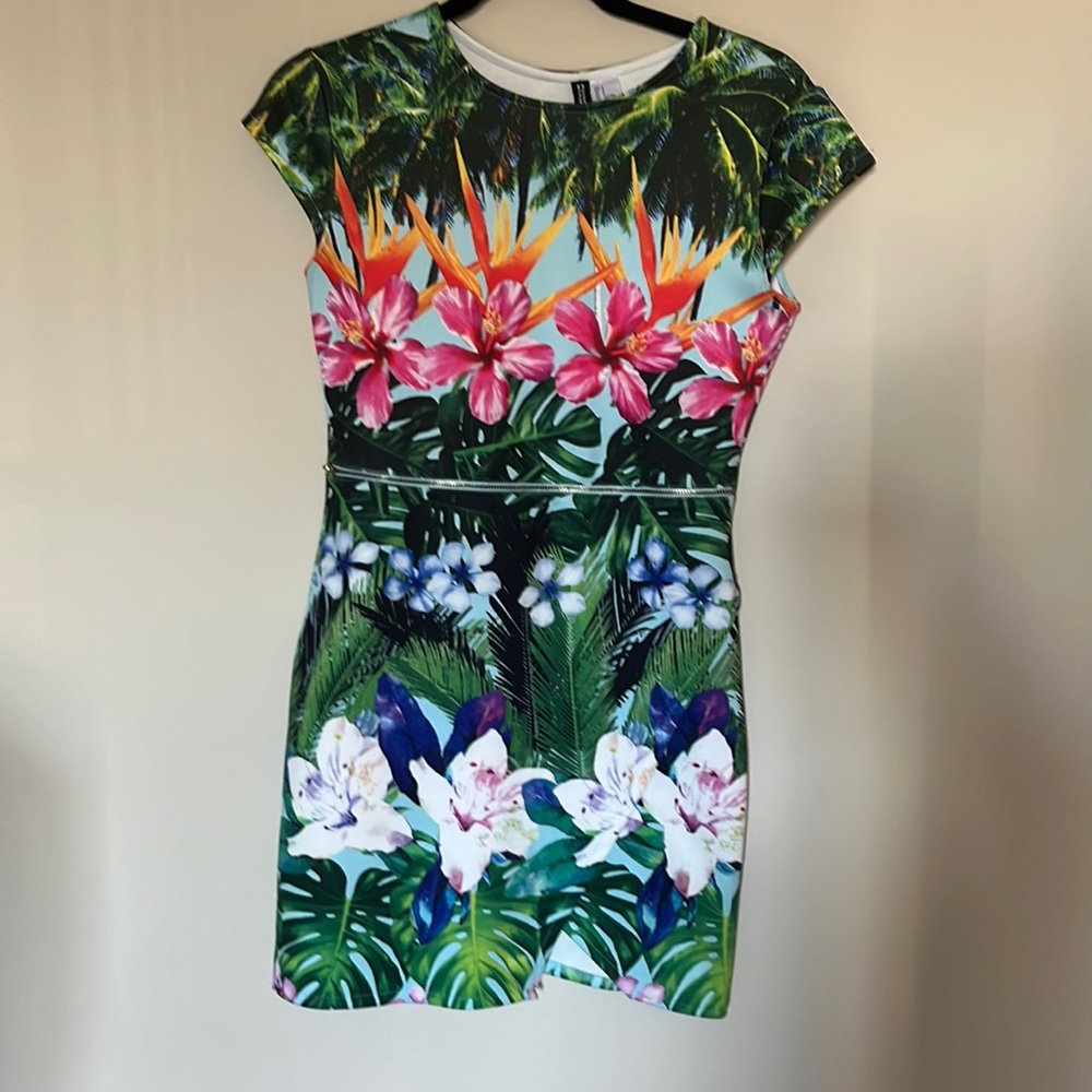Small tropical/floral mini dress with zipper detail and asymmetrical hem